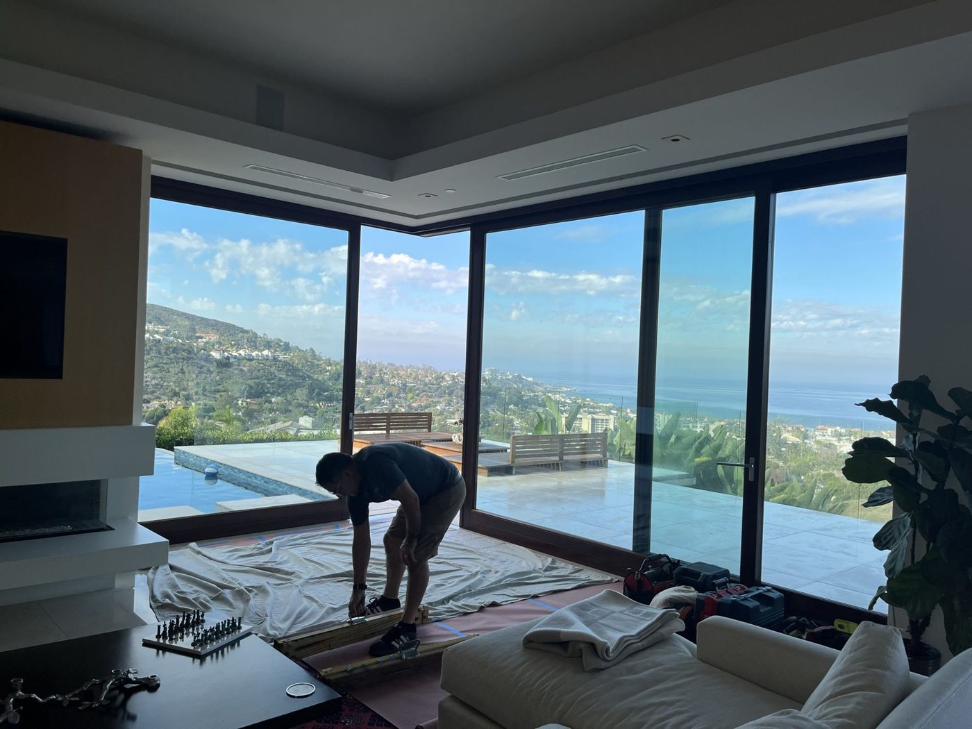 Technician working near a sliding door threshold