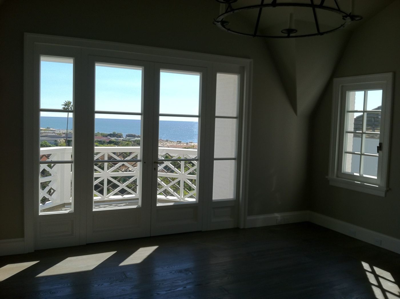 Finished French balcony doors showing door hardware